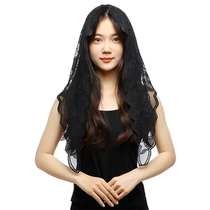 Detail of black floral lace mantilla veil with intricate embroidery and scalloped edges