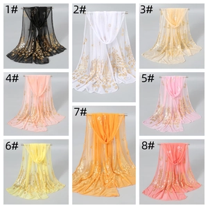 Detailed look at diverse colorful scarves featuring golden peacock feather foil prints