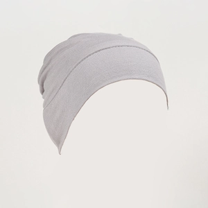Macro shot of light purple modal knitted turban hat with soft elastic fabric texture