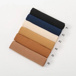 Detailed overhead view of six high-quality solid chiffon scarves in earthy tones