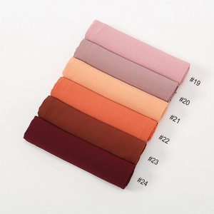 Detailed gradient color selection of soft chiffon hijabs from pale pink to deep burgundy