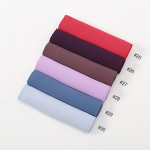 Detailed palette of solid color chiffon hijabs in various shades from red to blue