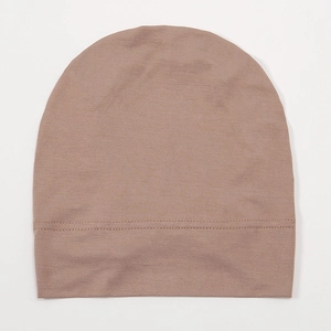 Minimalist solid color modal headscarf beanie in dusty pink for women, flat lay view