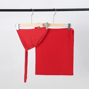 Detail of red chiffon hijab set with matching inner cap and long ties on hanger
