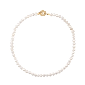 Elegant freshwater pearl necklace featuring a golden flower OT toggle clasp on white background