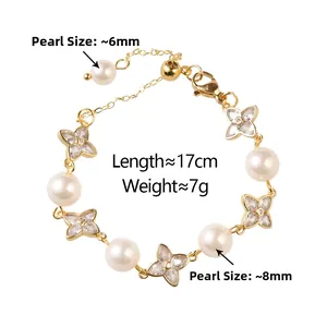 Detail of gold bracelet with 6mm and 8mm pearls plus crystal clover charms, 17cm long