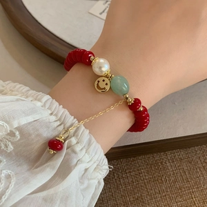 Retro beaded bracelet with red beads, white pearl and golden smiley face charm