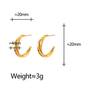 Boucles d'oreilles créoles dorées en C torsadées au design croisé de 20 mm