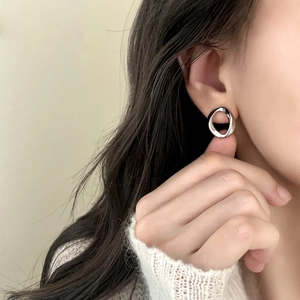 Minimalist geometric irregular circle stud earrings in silver finish with polished surface