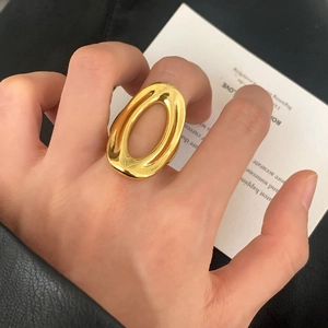 Polished gold hollow oval open ring with a thick minimalist geometric design for women