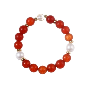 Retro red agate and pearl beaded bracelet with gold metal spacers on white background