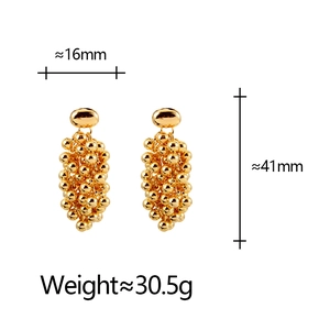 Boucles d'oreilles pendantes vintage en grappe de billes dorées au design français