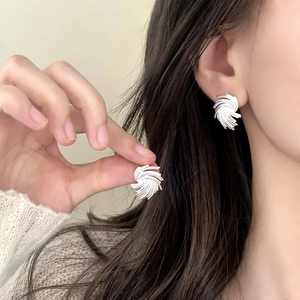 Elegant silver textured swirl earrings with a minimalist woven design for women