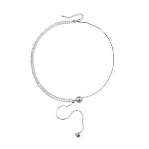 Asymmetrical silver snake chain necklace with rectangular zircons and a polished central bead