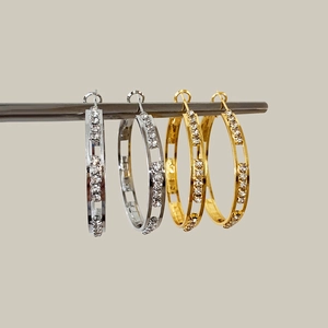 Boucles d'oreilles créoles évidées or et argent avec zircons coulissants