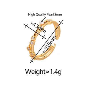 Adjustable gold plated pearl ring with cubic zirconia accents and textured band surface