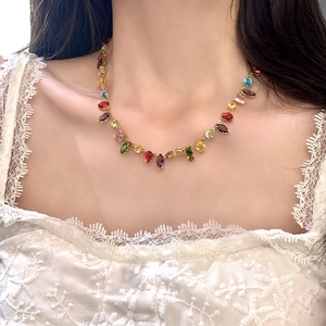 Elegant gold choker necklace with colorful marquise and drop-shaped zircon gemstones