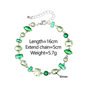 Detail of green zircon bracelet showing mixed-cut stones with adjustable extender chain