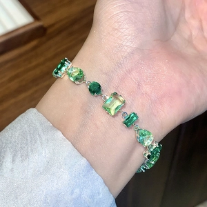 Elegant multi-green zircon bracelet with mixed cut stones on silver metal band