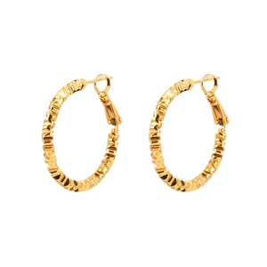Textured gold geometric hoop earrings with modern wavy pattern on a clean white background