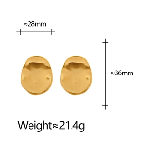 Golden brushed irregular oval stud earrings with wavy hammer texture on white background