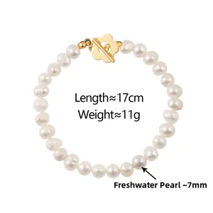 Detail of freshwater pearl necklace with gold petal-shaped OT clasp and 7mm pearls