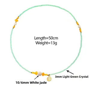 Detail of light green crystal multilayer necklace with white jade and gold Fu pendant