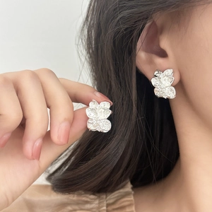 Elegant silver leaf stud earrings with sparkling cubic zirconia for a refined aesthetic