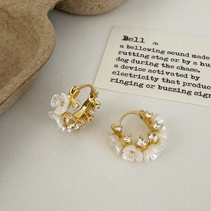 French vintage gold flower earrings with white petals and sparkling cubic zirconia stones