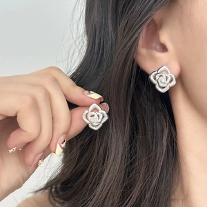 Silver rose stud earrings with brushed texture petals for an elegant vintage women's look