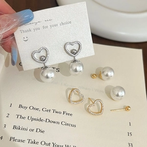 Elegant heart-shaped pearl drop earrings with zircon crystals in gold and silver plating
