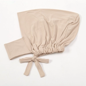 Detailed back view of beige milk silk elastic under-hijab cap with adjustable bow tie