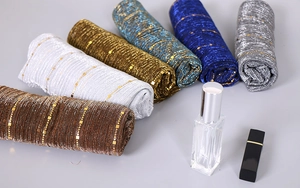 Detailed texture of sequin lace scarves with metallic shimmer in various elegant colors