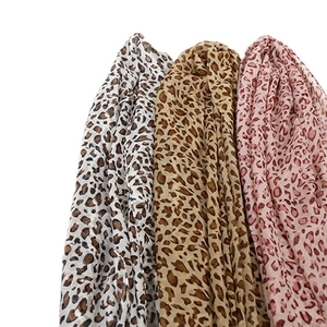 Three leopard print chiffon neck scarves in grey, classic camel, and soft pink shades