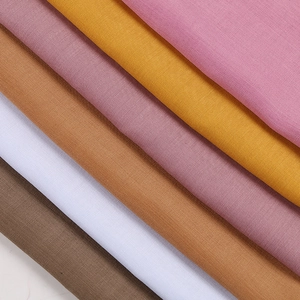 Stack of 110x110cm minimalist solid color square scarves in linen texture cotton fabric
