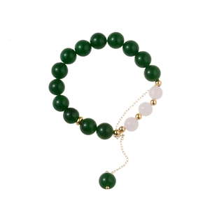 Vintage green agate beaded bracelet with white jade beads and golden metallic accents
