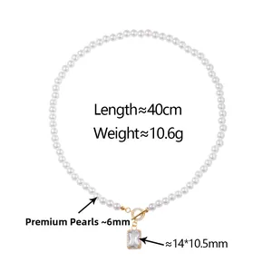 Detailed view of pearl necklace with gold OT clasp and cubic zirconia pendant size specs