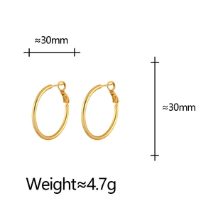 Detail view of 30mm matte gold hoop earrings showing size and weight specifications