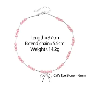 Collier en perles d'oeil de chat rose avec pendentif nœud argenté et chaîne de 37 cm