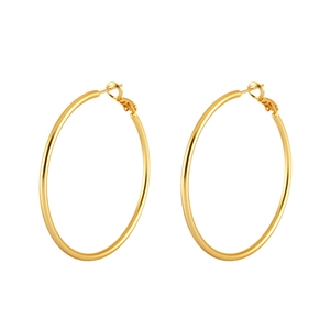 Close-up of large gold round hoop earrings with detailed clasp and polished finish