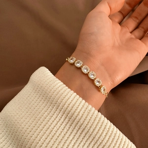 Minimalist gold bracelet with seven sparkling round cubic zirconia for women