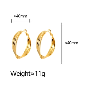 Detail view of 40mm gold Mobius earrings with textured finish and size dimensions