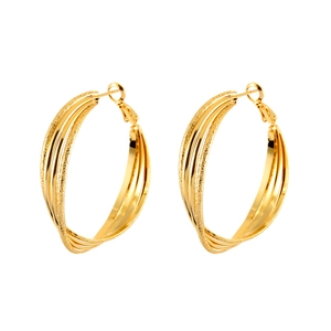 Detail of overlapping Mobius loop earrings with polished and frosted golden finish