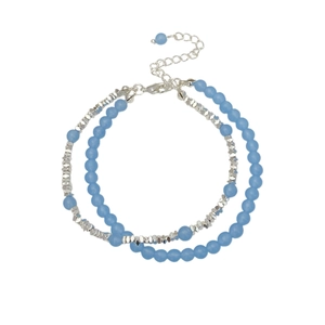 Double-layered bracelet with light blue natural stones and silver beads on a white background