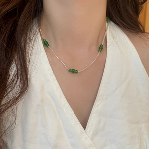 Handmade beaded necklace set featuring natural green stones and clear seed beads for women