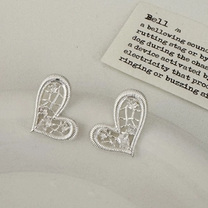 Minimalist silver heart stud earrings with sparkling stones and textured metal border