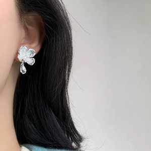 French style silver flower earrings with pleated texture and irregular pendant detail