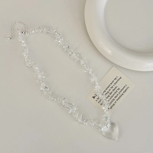 Elegant crystal necklace featuring irregular clear stones and a heart-shaped pendant