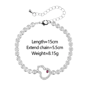 Detail view of silver gourd bracelet with red crystal and sparkling cubic zirconia
