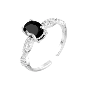 European vintage silver ring with oval black gemstone and twisted zircon pavé band